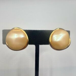 Monet vintage gold tone clip on earrings with large faux pearls.